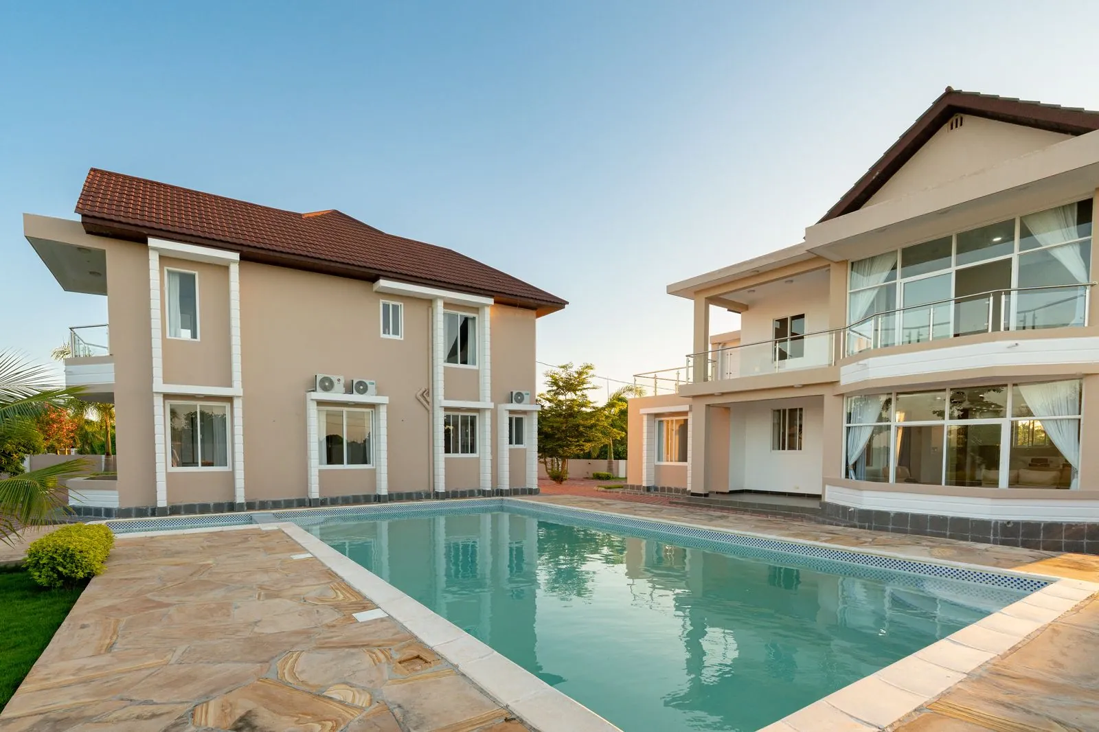 Villas and pool at golden hour